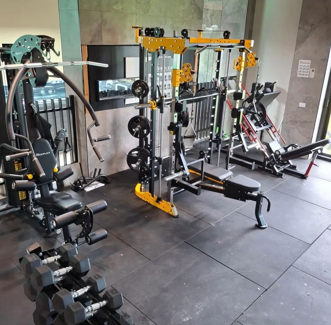 Triumph gym installation — modern gym with yellow and black multi-station weight machine