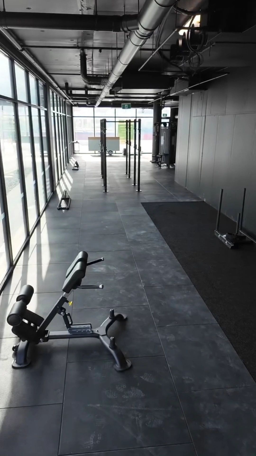 Triumph gym installation — industrial style gym interior with polished concrete flooring